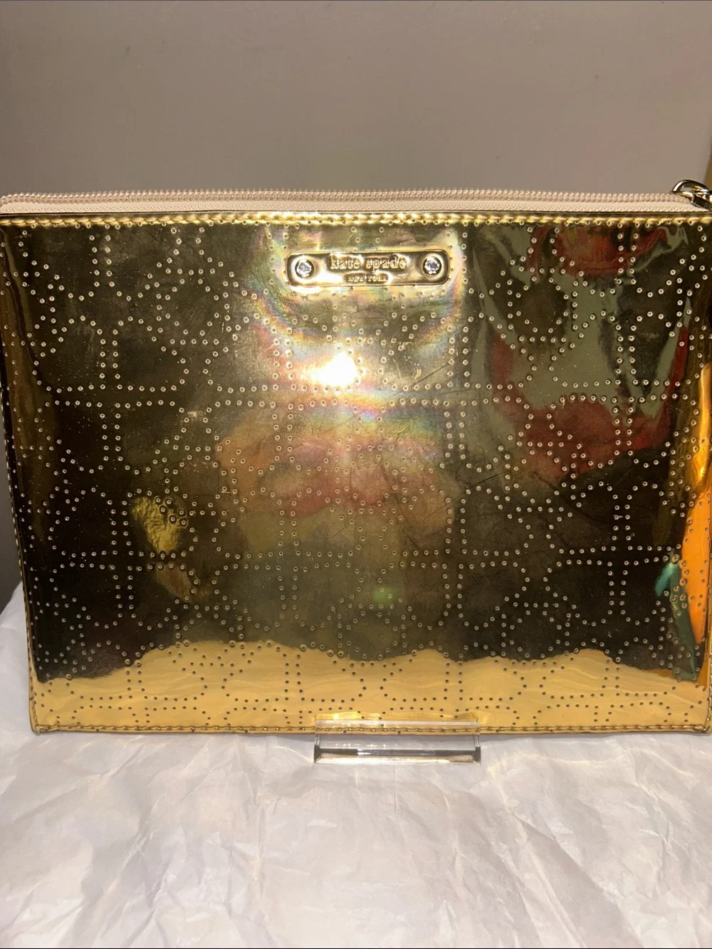 Kate Spade New York metallic gold pouch featuring a perforated spade pattern EUC